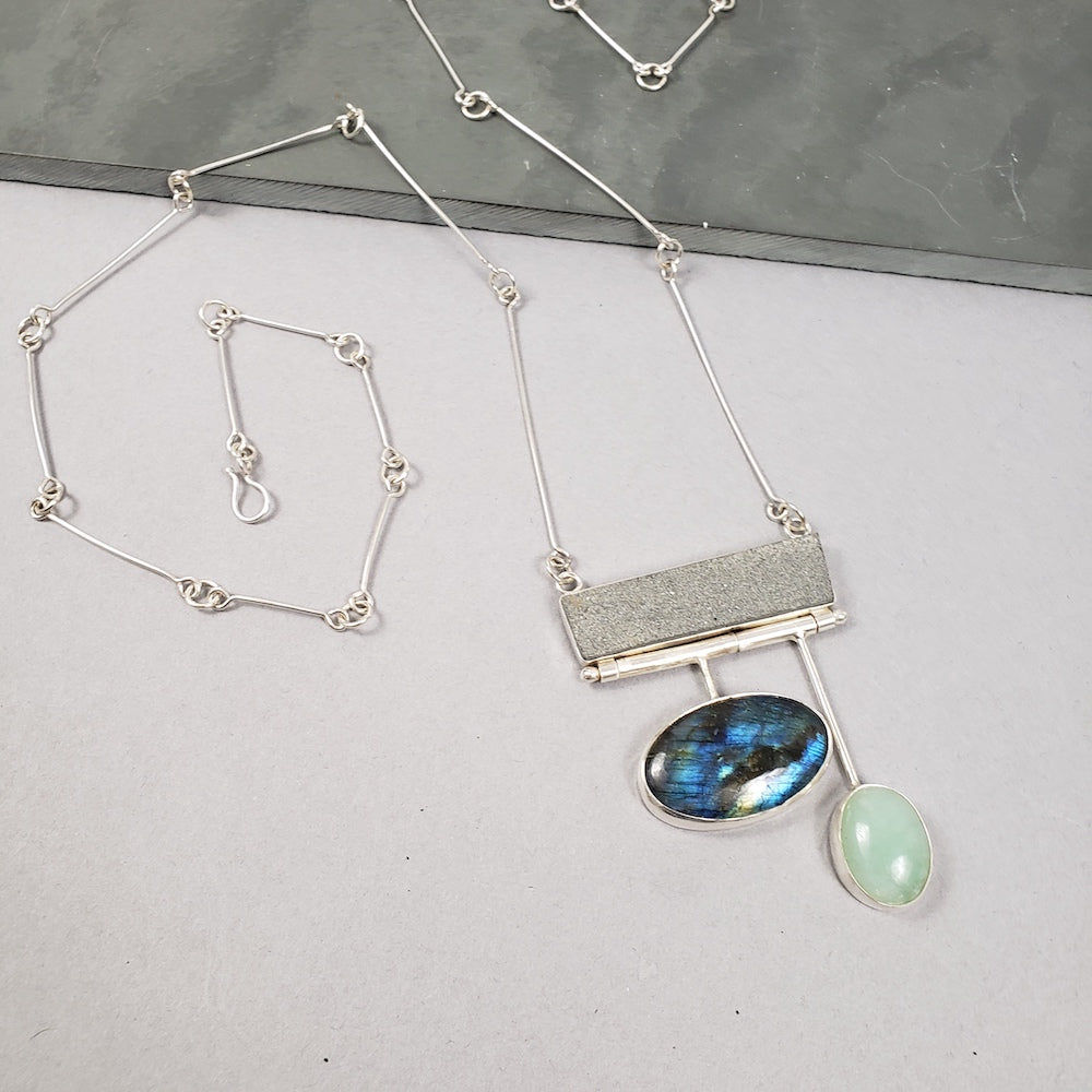Handmade swing necklace featuring slate and colorful labradorite stone on silver chain