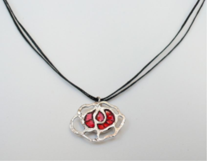 Handmade mini flower necklace featuring a silver pendant with a red flower design