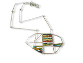 Mosaic Necklace featuring colorful geometric designs on a silver chain from The W Gallery