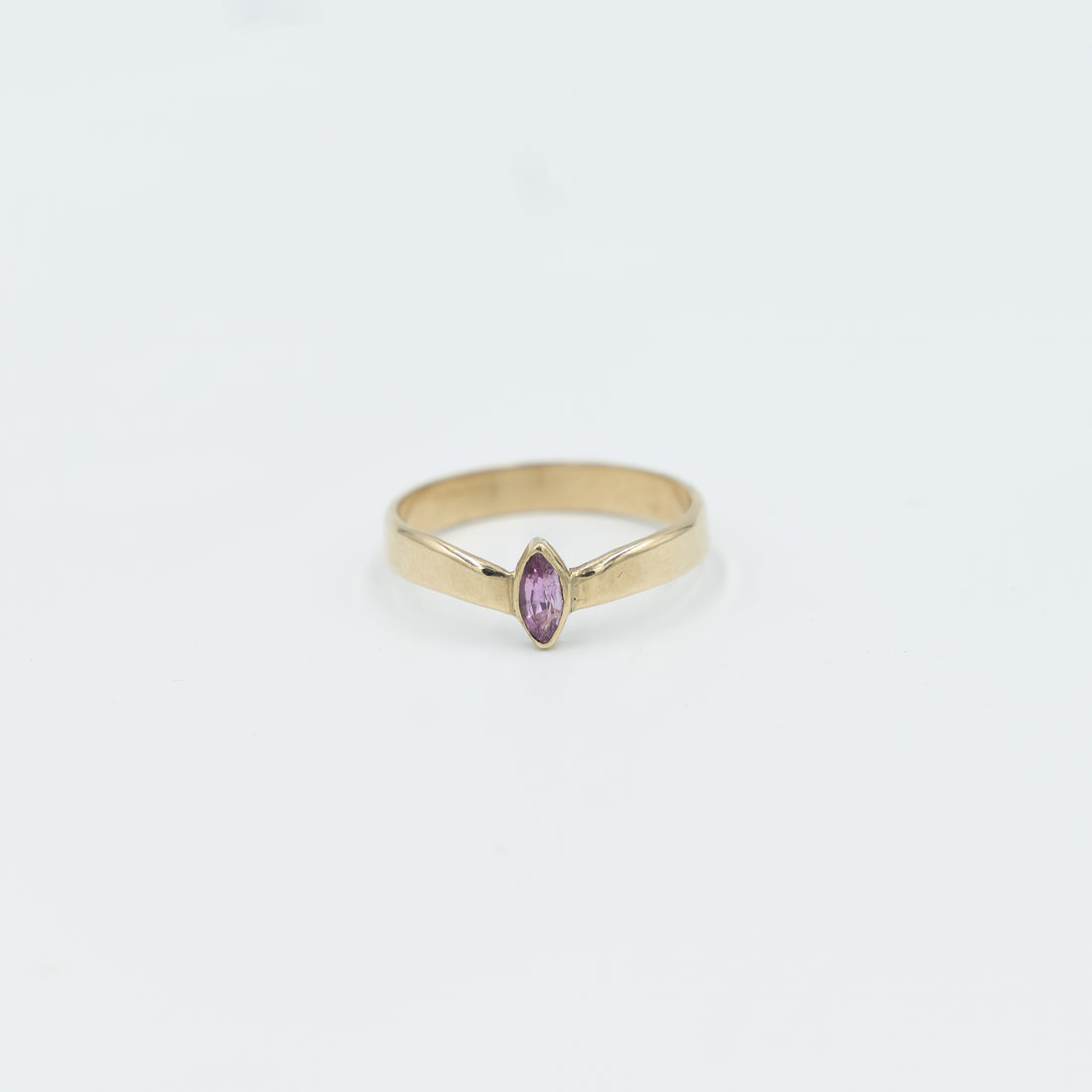 Elegant gold tiara ring for women featuring a pink stone, perfect for any jewelry collection