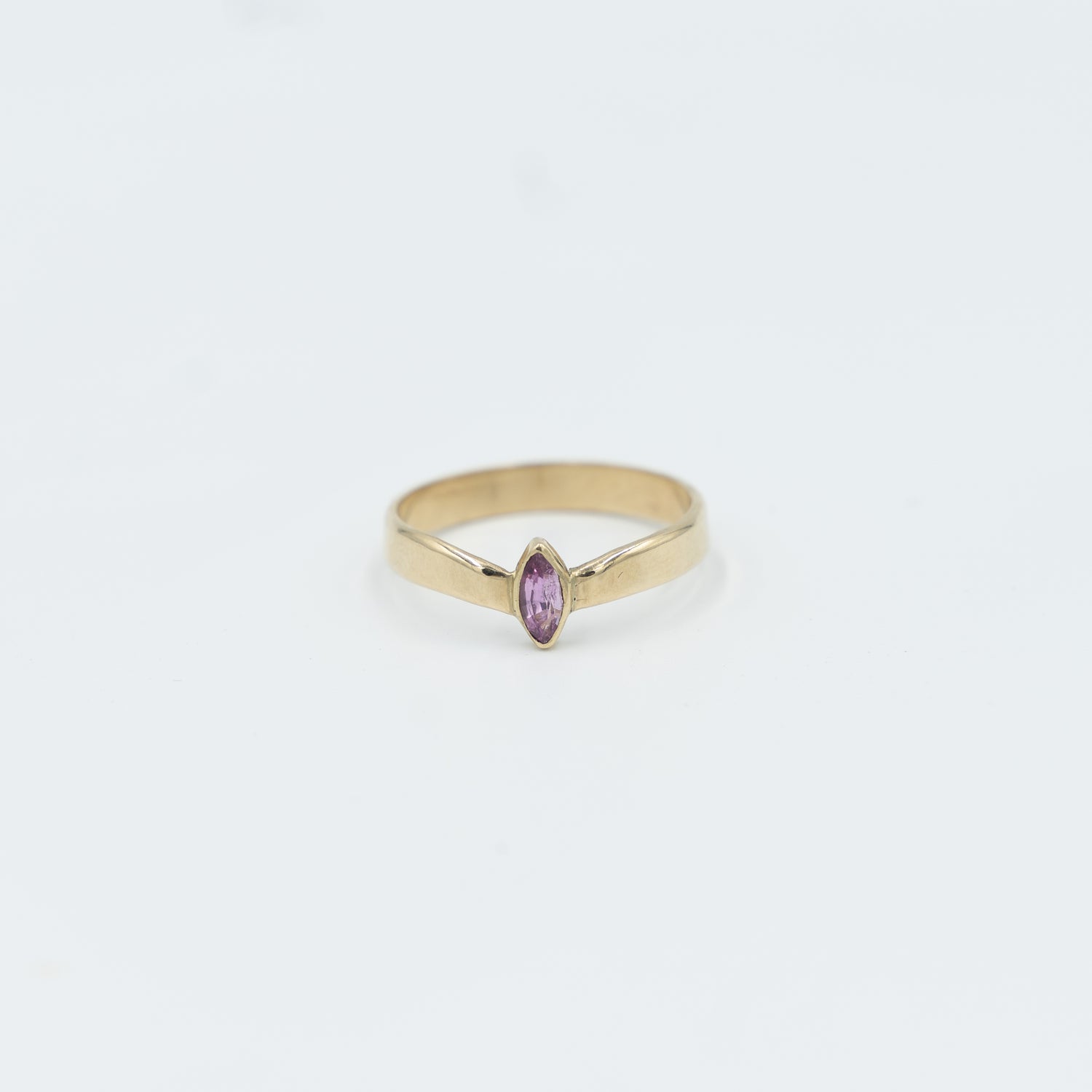 Elegant gold tiara ring for women featuring a pink stone, perfect for any jewelry collection