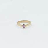 Elegant gold tiara ring for women featuring a pink stone, perfect for any jewelry collection