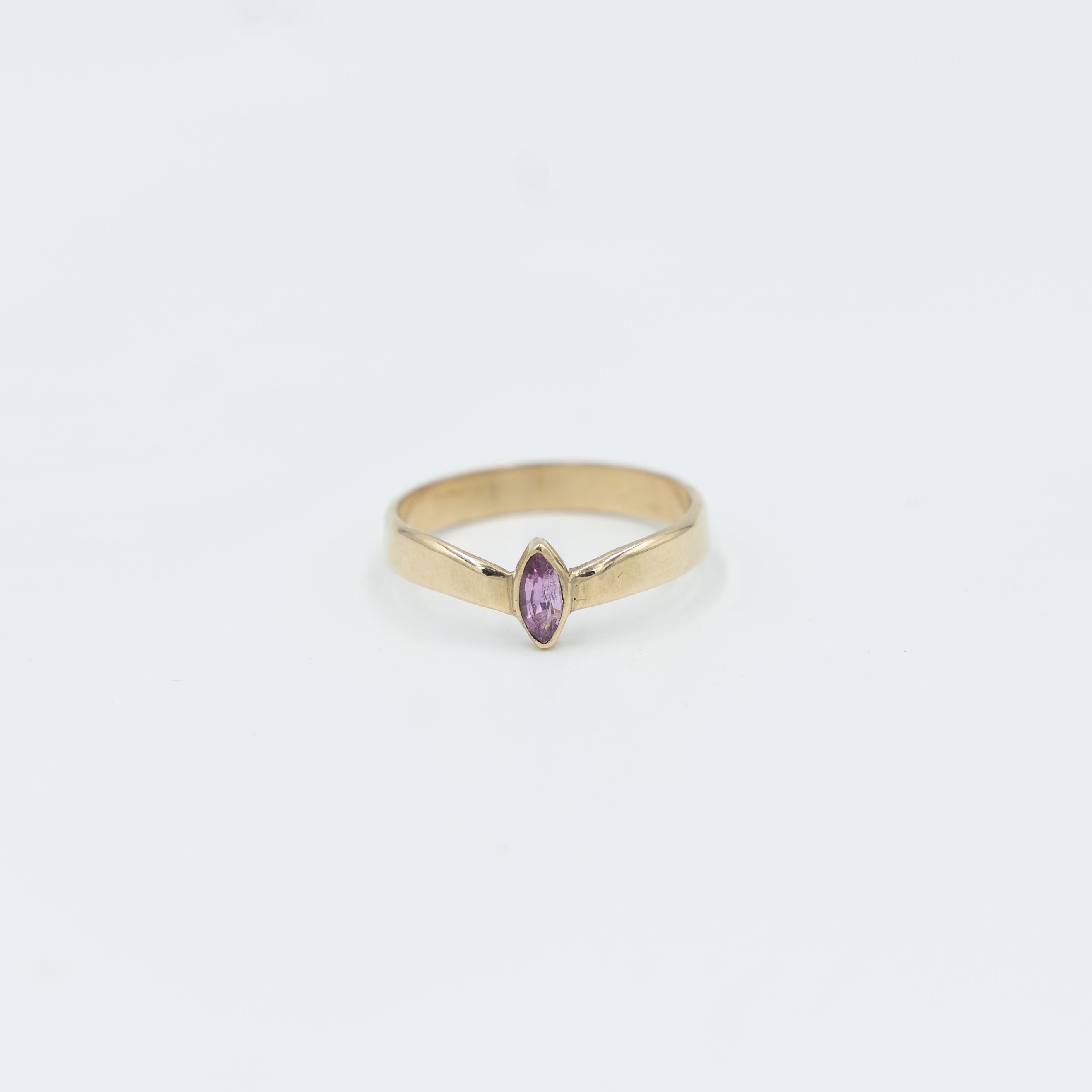 Elegant gold tiara ring for women featuring a pink stone, perfect for any jewelry collection