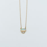 Unique opal pendant necklace with a delicate gold chain and oval opal stone from Tess Young Jewelry at The W Gallery
