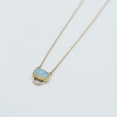 Unique opal pendant necklace featuring a stunning opal stone set in gold from Tess Young Jewelry