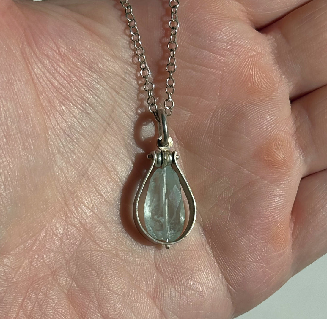 Fig Drop Pendant Necklace by Ayala Naphtali displayed in hand, featuring a tear-shaped gemstone
