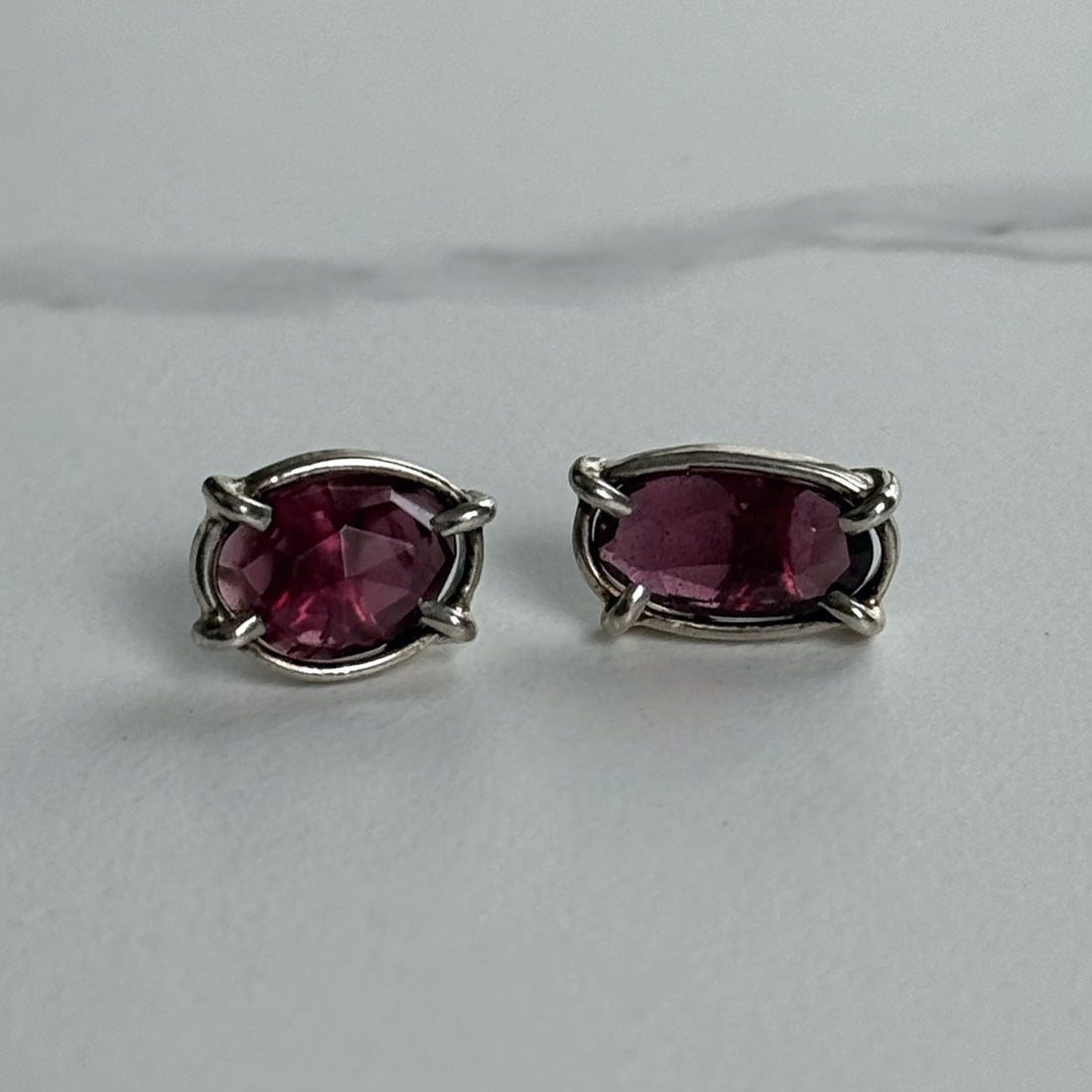 Elegant Rhodolite garnet earrings in silver settings from Jen Surine available at The W Gallery